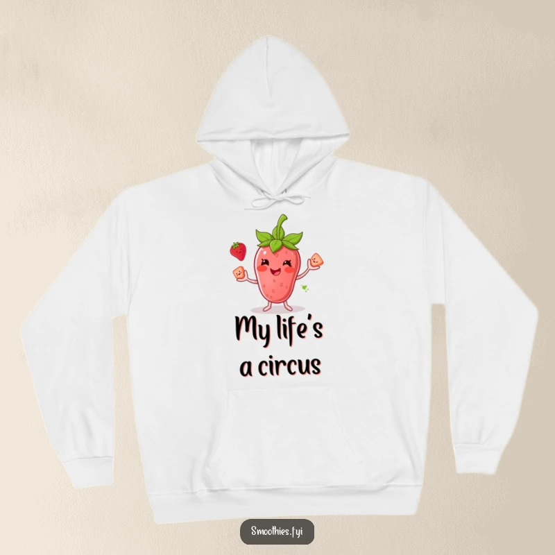 Funny hoodie depicting a smiling anthropomorphic strawberry smoothie juggling fruit chunks, offering warmth and cheerful vibes.