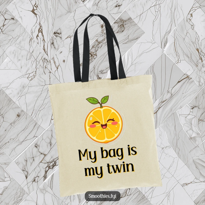 Funny tote bag showcasing a cheerful tangerine winking as it splits itself in half, a practical and amusing accessory.